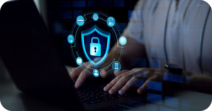 Person typing on a laptop with a digital lock and security icons overlay, representing cybersecurity and data protection.